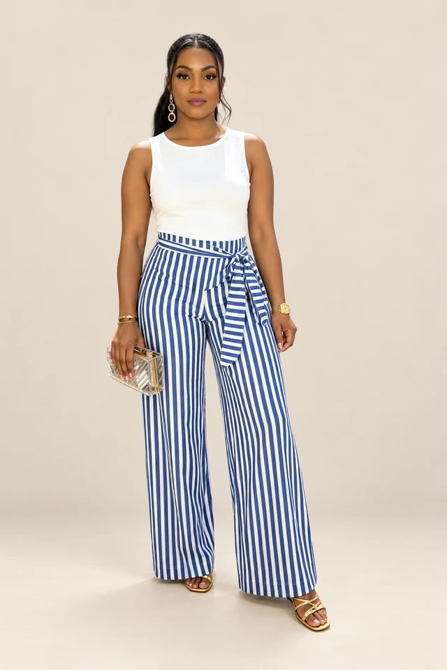 Blue stripe trousers & white top.
