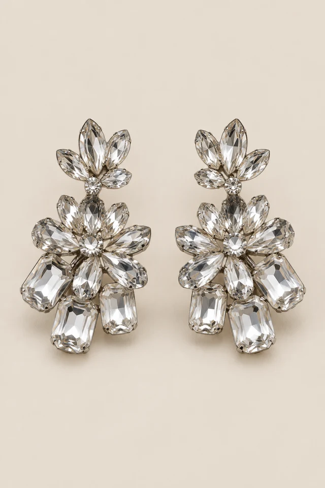 Clustered clear-stone floral statement earrings.