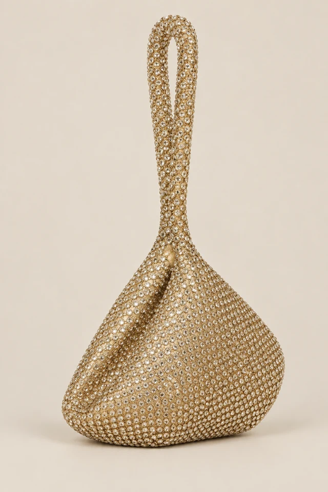 Gold-tone sparkling evening bag with a long handle.