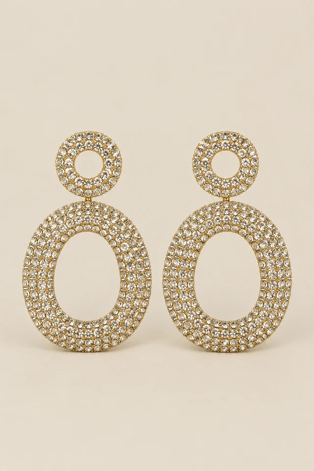 Round stud and open oval sparkling drop earrings.