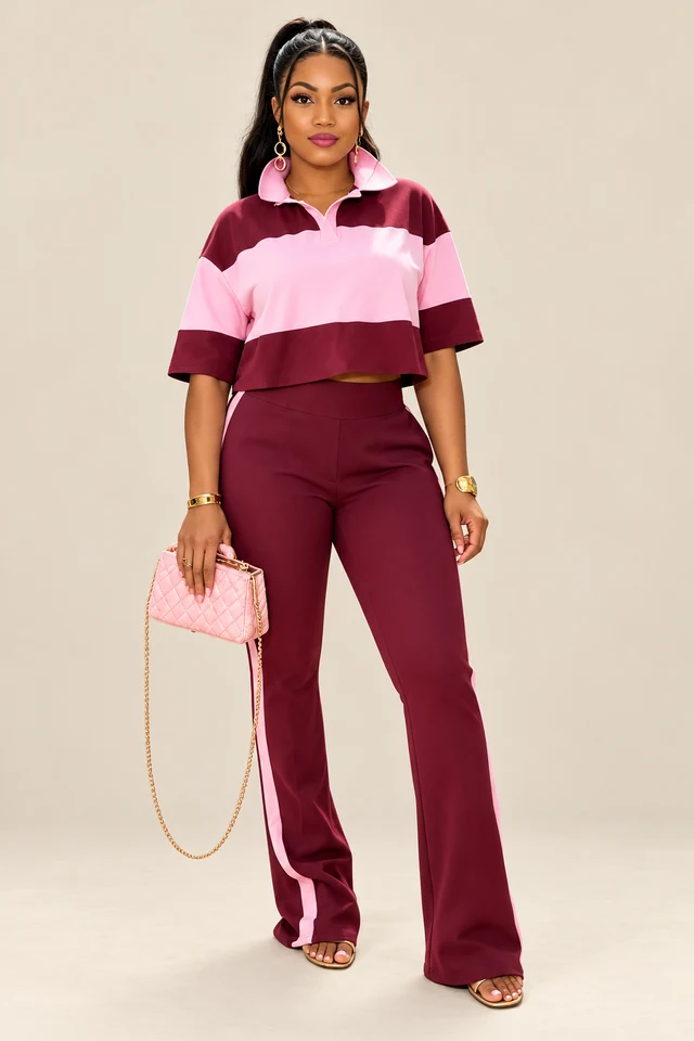 Burgundy and pink striped oversized crop top with matching pants.